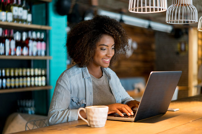 woman researching on laptop