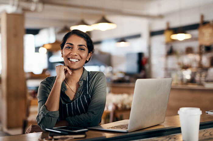 smiling coffee shop owner