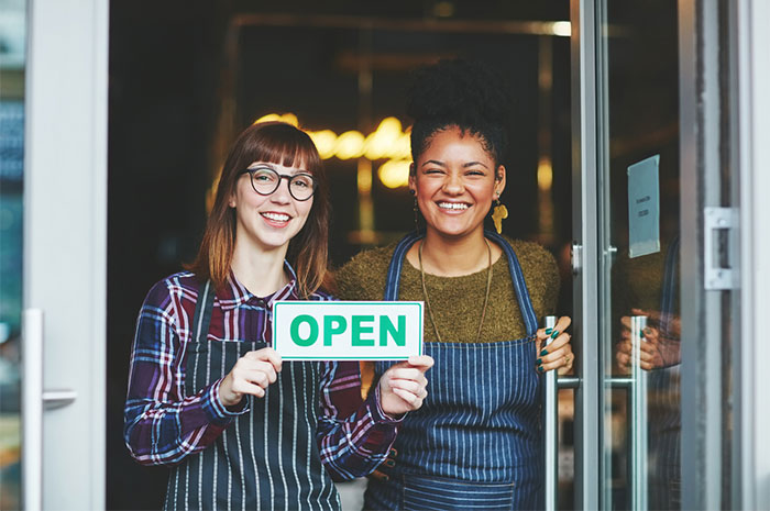 smiling restaurant owners