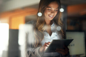 woman using laptop at night